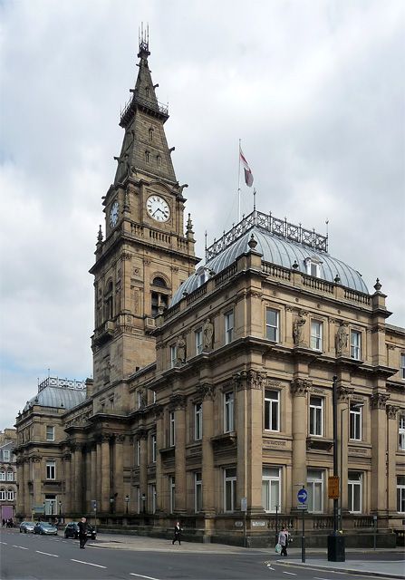 an old building with a clock tower on top