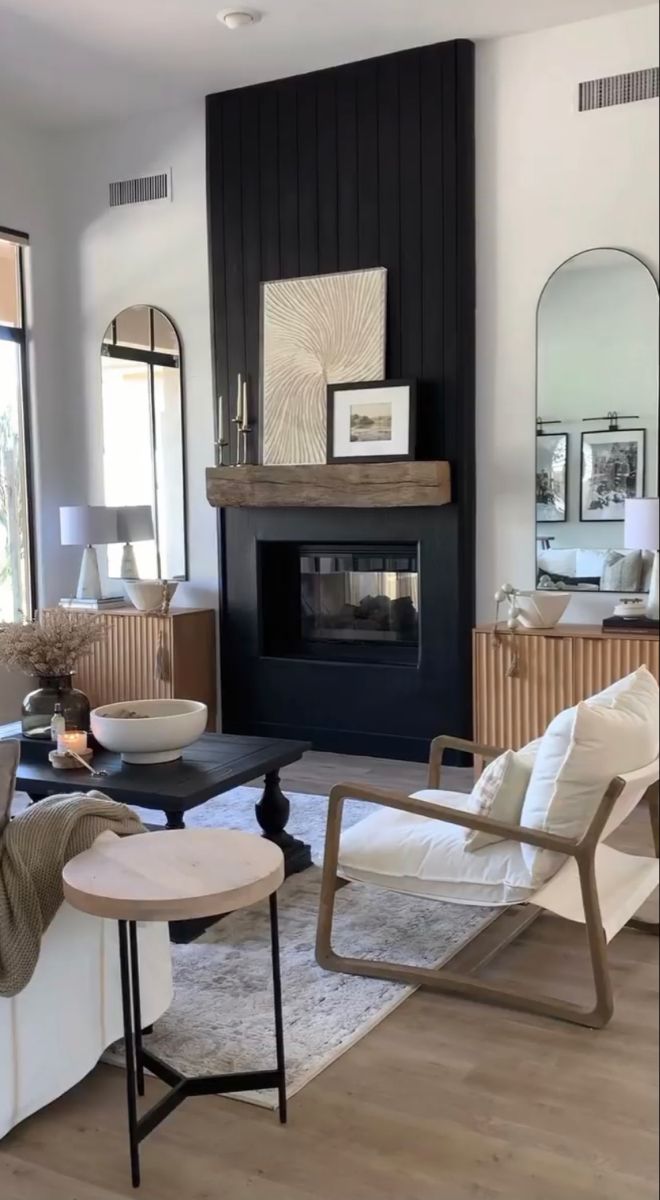 a living room filled with furniture and a fire place in the middle of a room