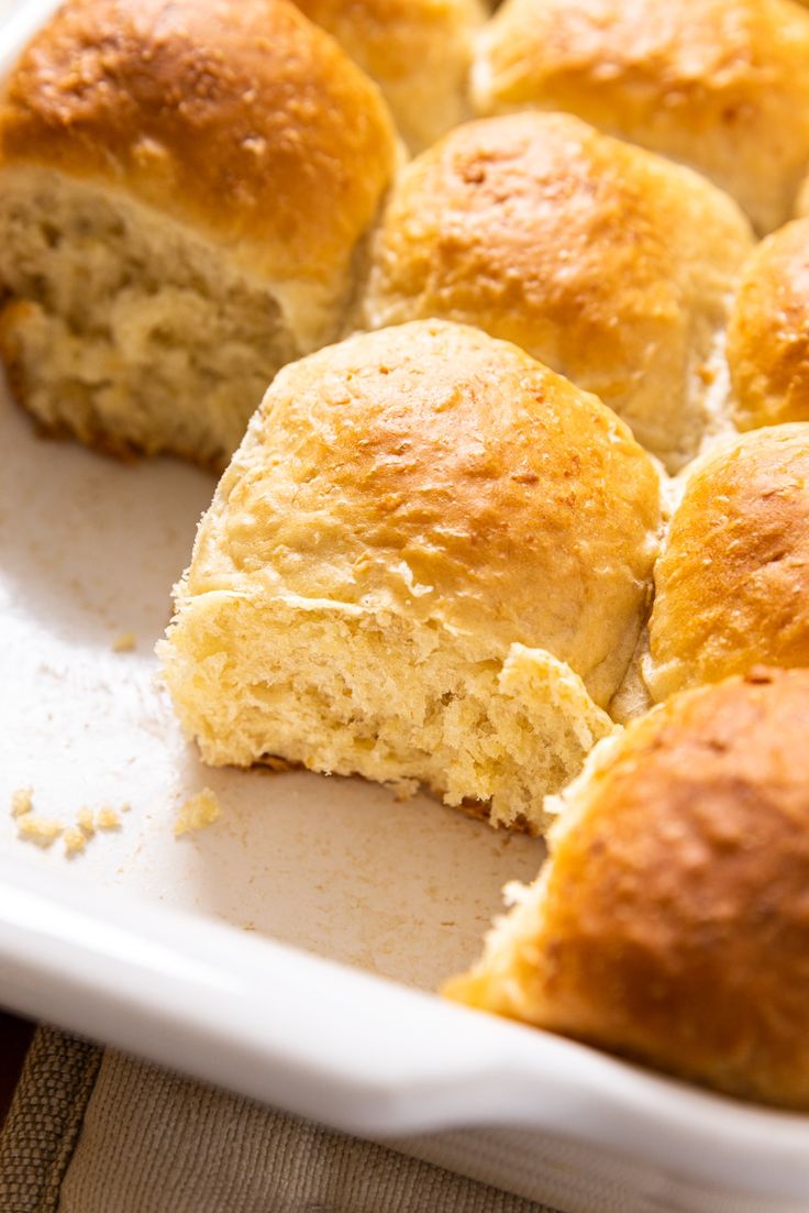 a close up of some bread rolls in a pan