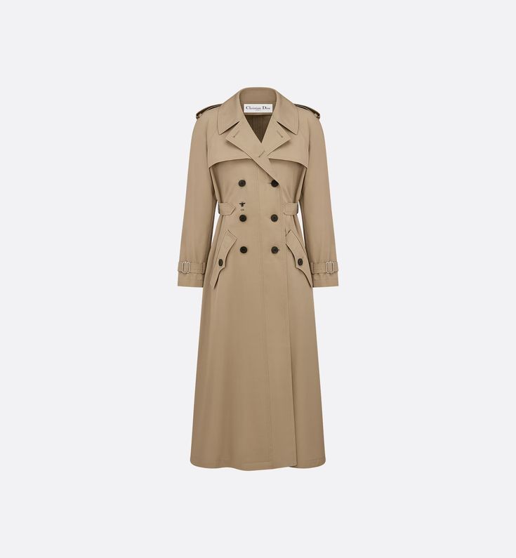 The beige trench coat presents a refined new take on an essential wardrobe piece. Crafted in cotton, it is enhanced by a contrasting embroidered bee on the front, a key symbol of the House. The adjustable side placket highlights the waist, while topstitched details and pointed pockets with buttoned flaps create a sophisticated look. The trench coat may be paired with any piece for a casual or elegant look. Trench Coat Beige, Embroidered Bee, Essential Wardrobe Pieces, Trench Beige, Beige Trench Coat, Essential Wardrobe, Christian Dior Couture, Dior Couture, The Paradise