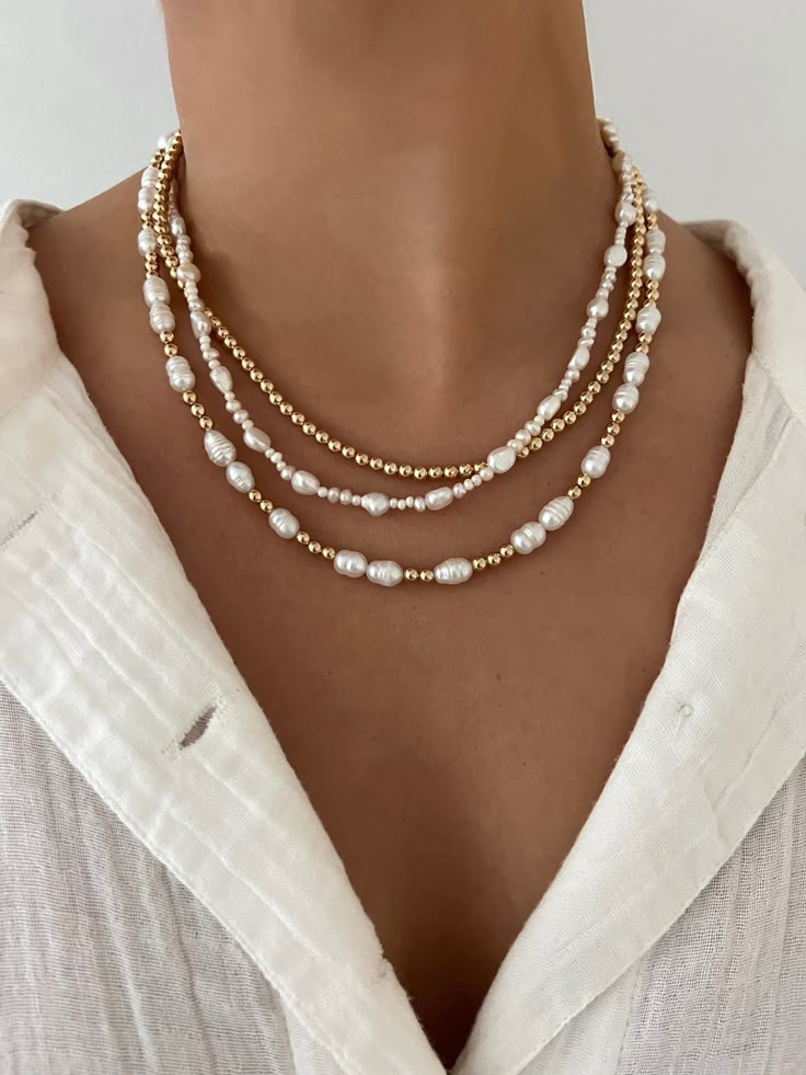 Add this with any stack for some added style or wear it alone for a classy look Made with freshwater pearls & 14k gold filled beads 15 inches with 2 inch extender Gold Beaded Pearl Layered Necklace, Gold Pearl Beaded Layered Necklace, Gold Pearl Beaded Necklace Single Strand, Elegant Beaded Necklaces With 14k Gold Filled Beads, Elegant 14k Gold-filled Beaded Necklaces, Adjustable Pearl Necklaces With Gold Beads, Necklaces With Pearls, Beaded Jewelry Necklaces, Beaded Necklace Designs