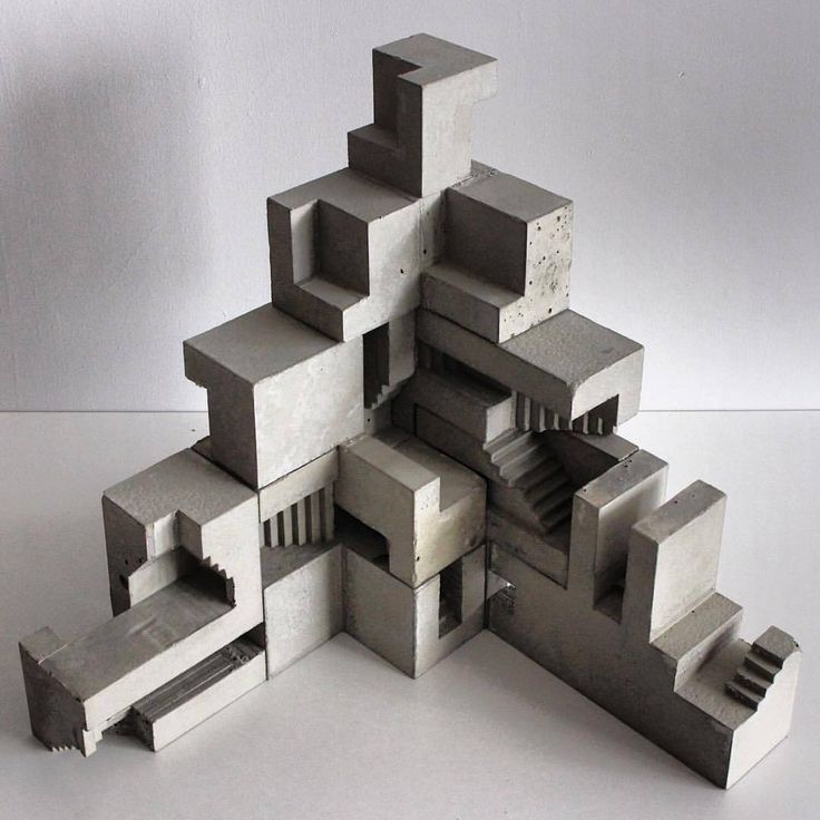 an abstract sculpture made out of concrete blocks