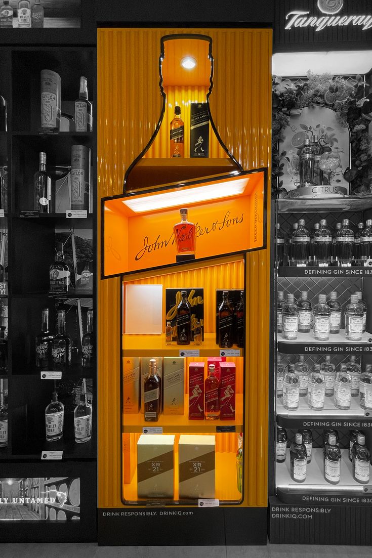 an old fashioned vending machine is lit up in black and white with orange accents