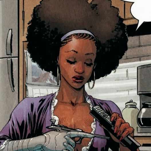 a woman with an afro blow dryer in her hand and a comic bubble above her head