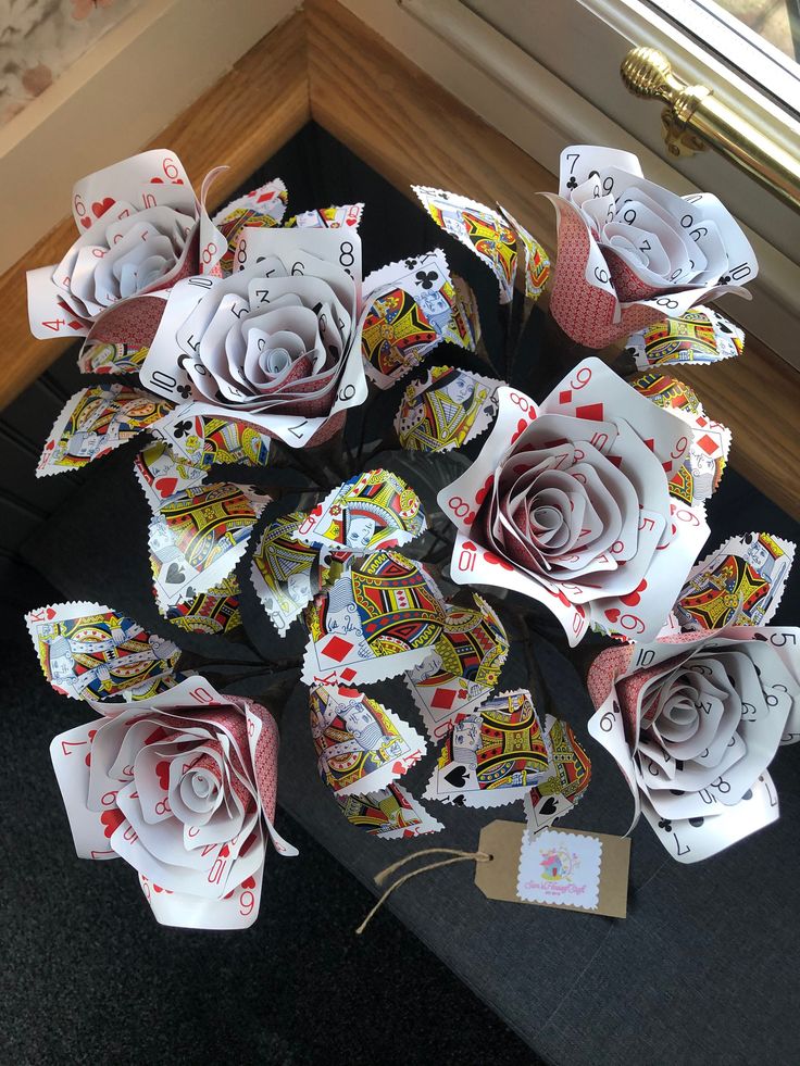 several paper roses are arranged on a table