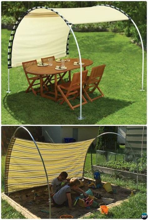 an outdoor table and chairs in the grass with a canopy over it that is open to allow