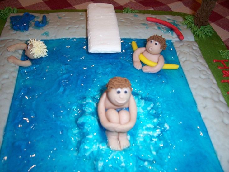 there is a cake that looks like people in the water