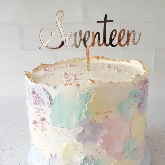 there is a cake that has been decorated with pastel colors and the word sweeter on it