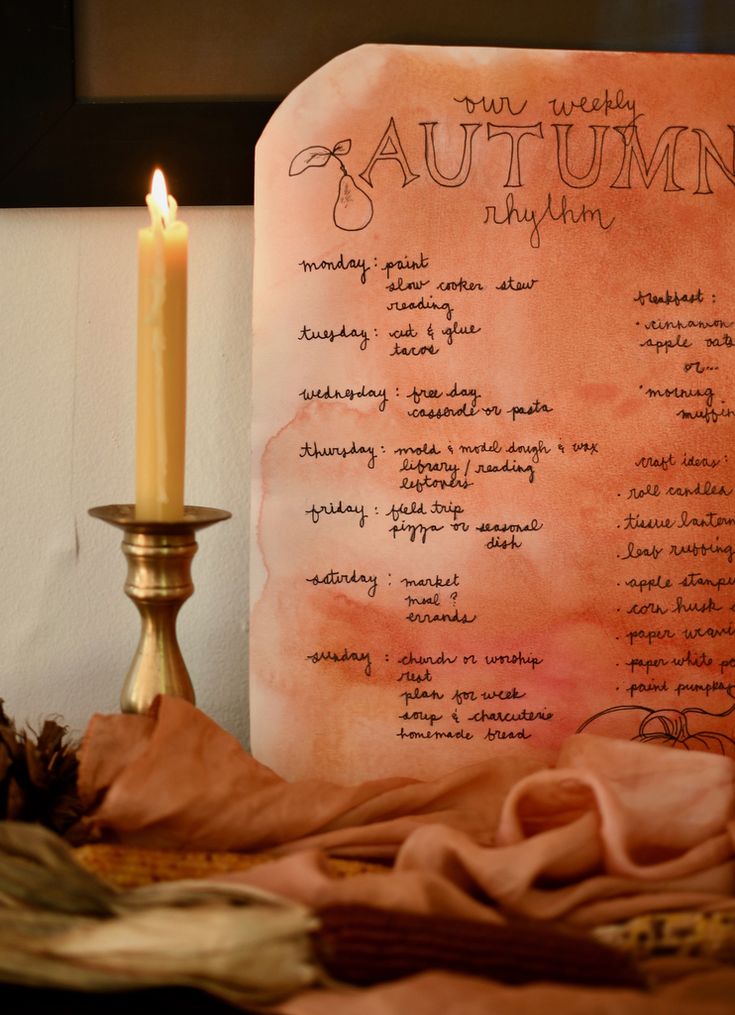 an autumn menu with a lit candle