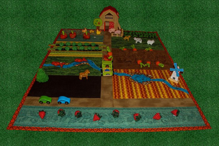 an image of a farm scene quilted on the ground