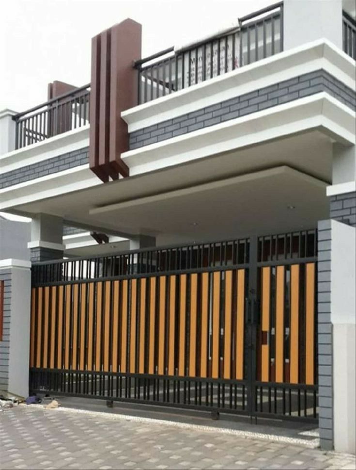 a house that has been fenced in with wooden slats on the front and sides