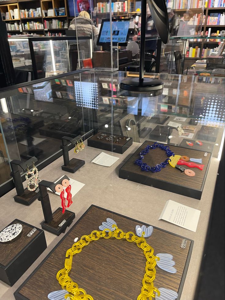 a display case filled with lots of different types of necklaces and other jewelry items