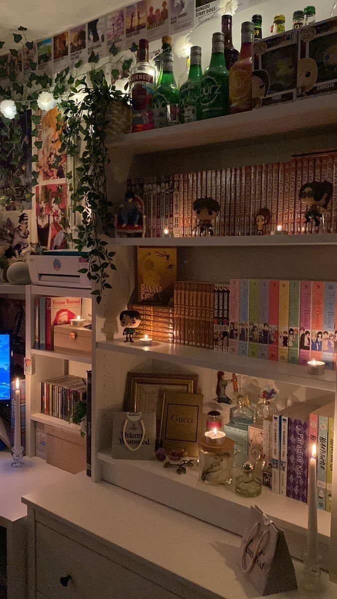 a living room filled with lots of books and candles