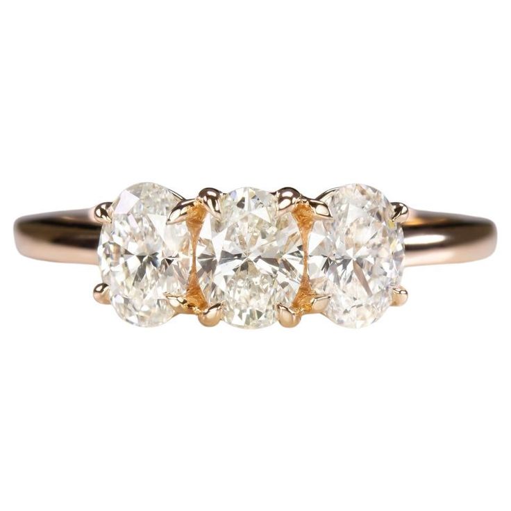 three stone diamond ring in yellow gold