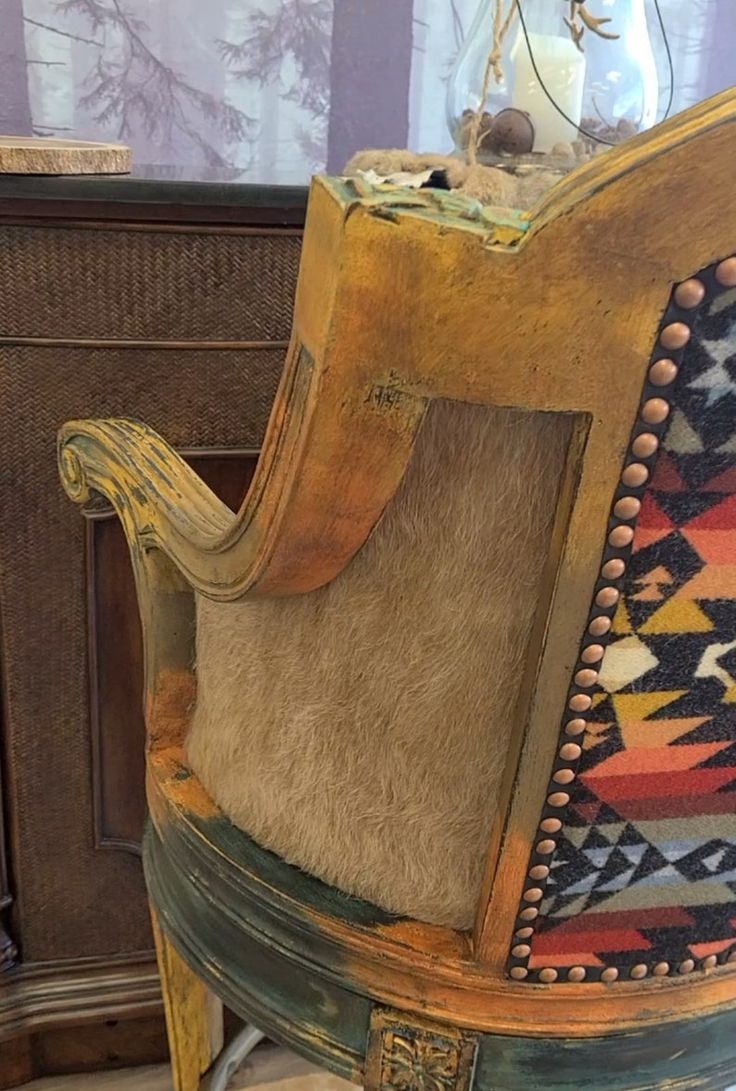 an old chair is sitting on the floor