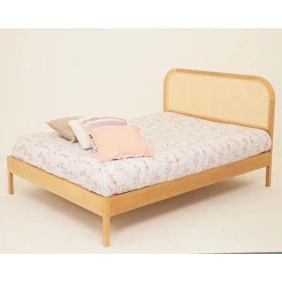 a small bed with a wooden frame and headboard is shown in this image, it has a pillow on top