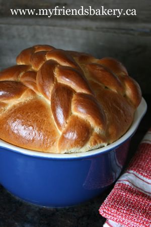 a loaf of bread in a blue bowl