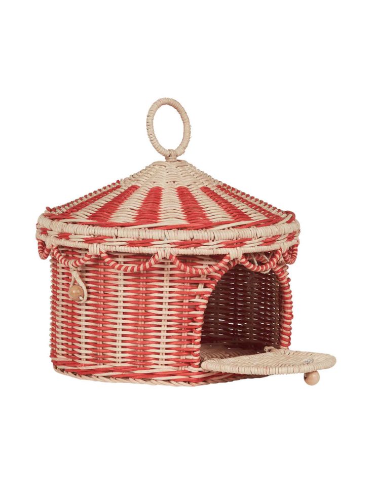 a red and white wicker cat house