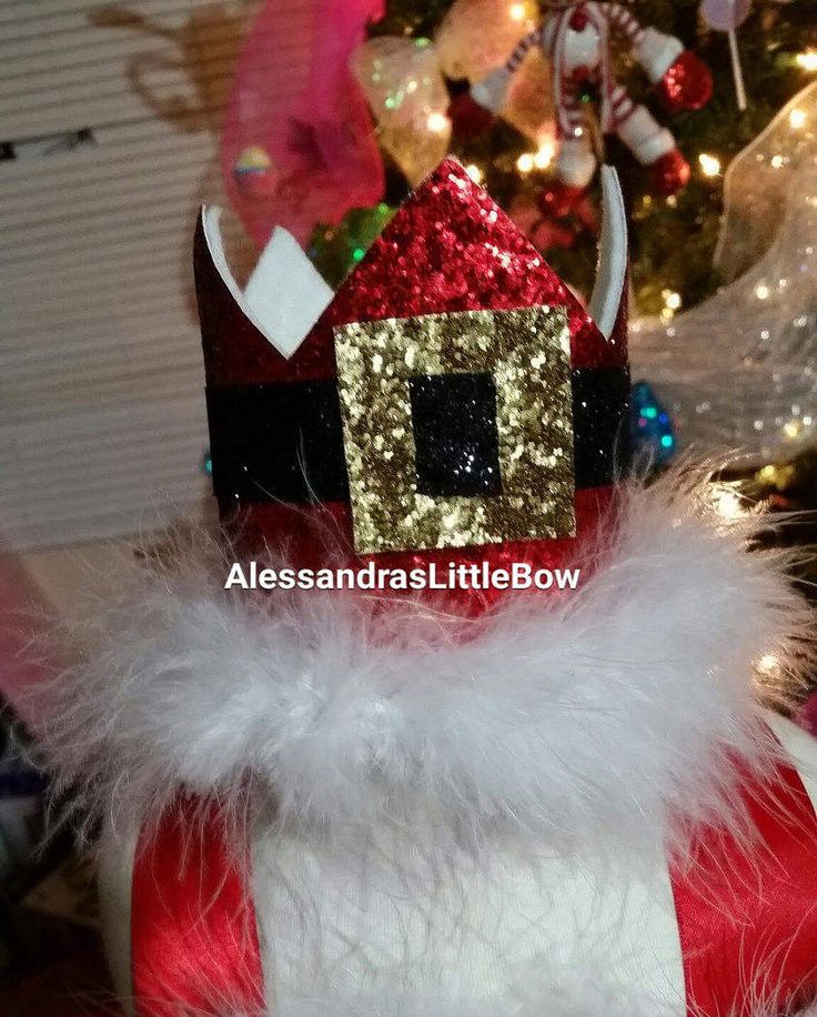 a close up of a santa clause hat on top of a christmas ornament