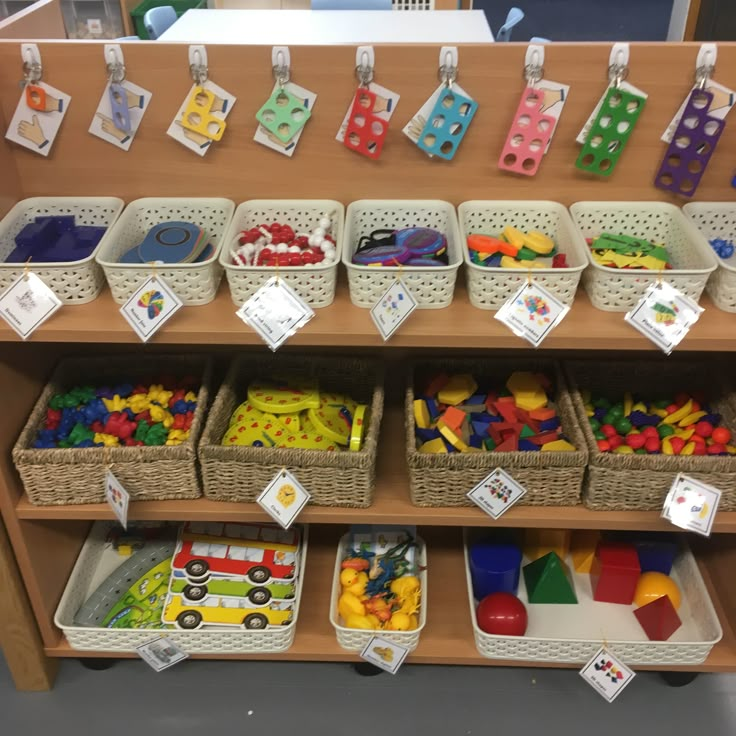 the shelves are filled with toys for children to play