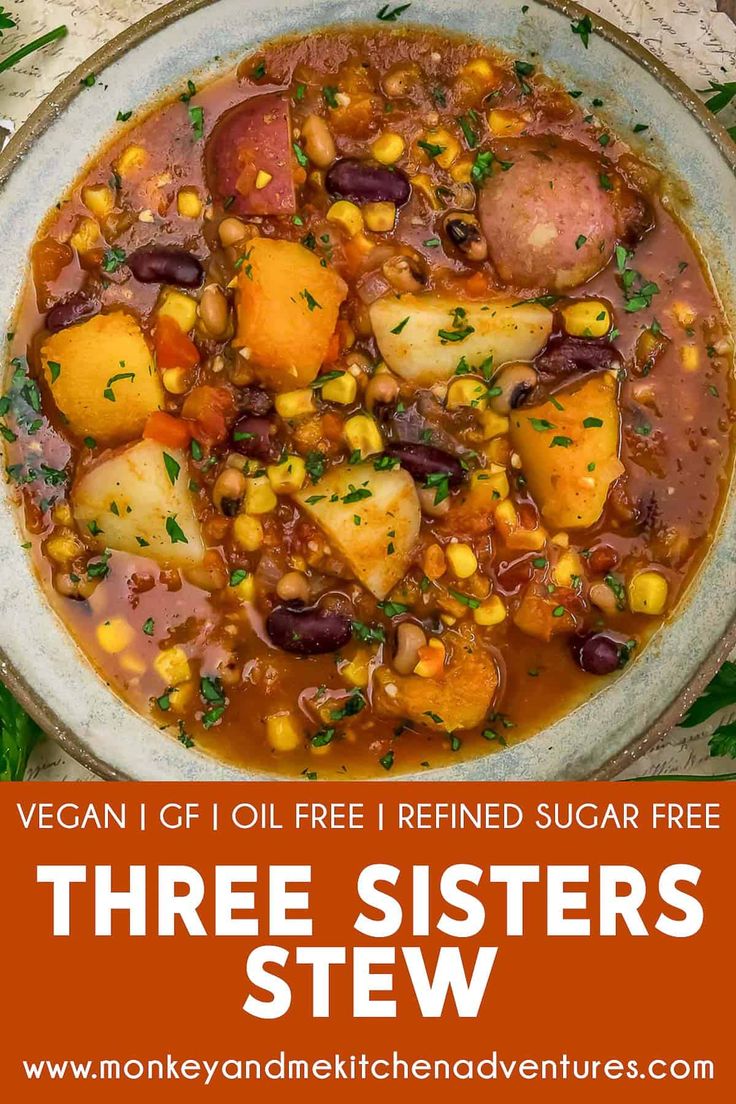 three sisters stew with potatoes and corn in a white bowl on top of a wooden table