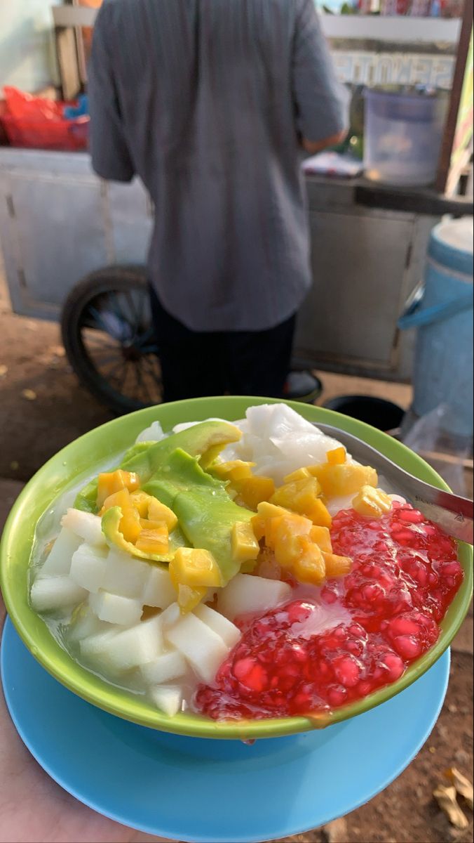 a person holding a plate with food on it