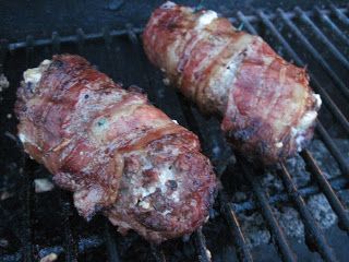 two pieces of meat are cooking on the grill