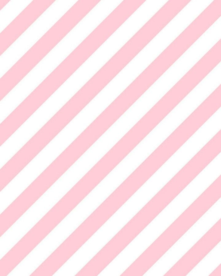 a pink and white striped background with diagonal stripes