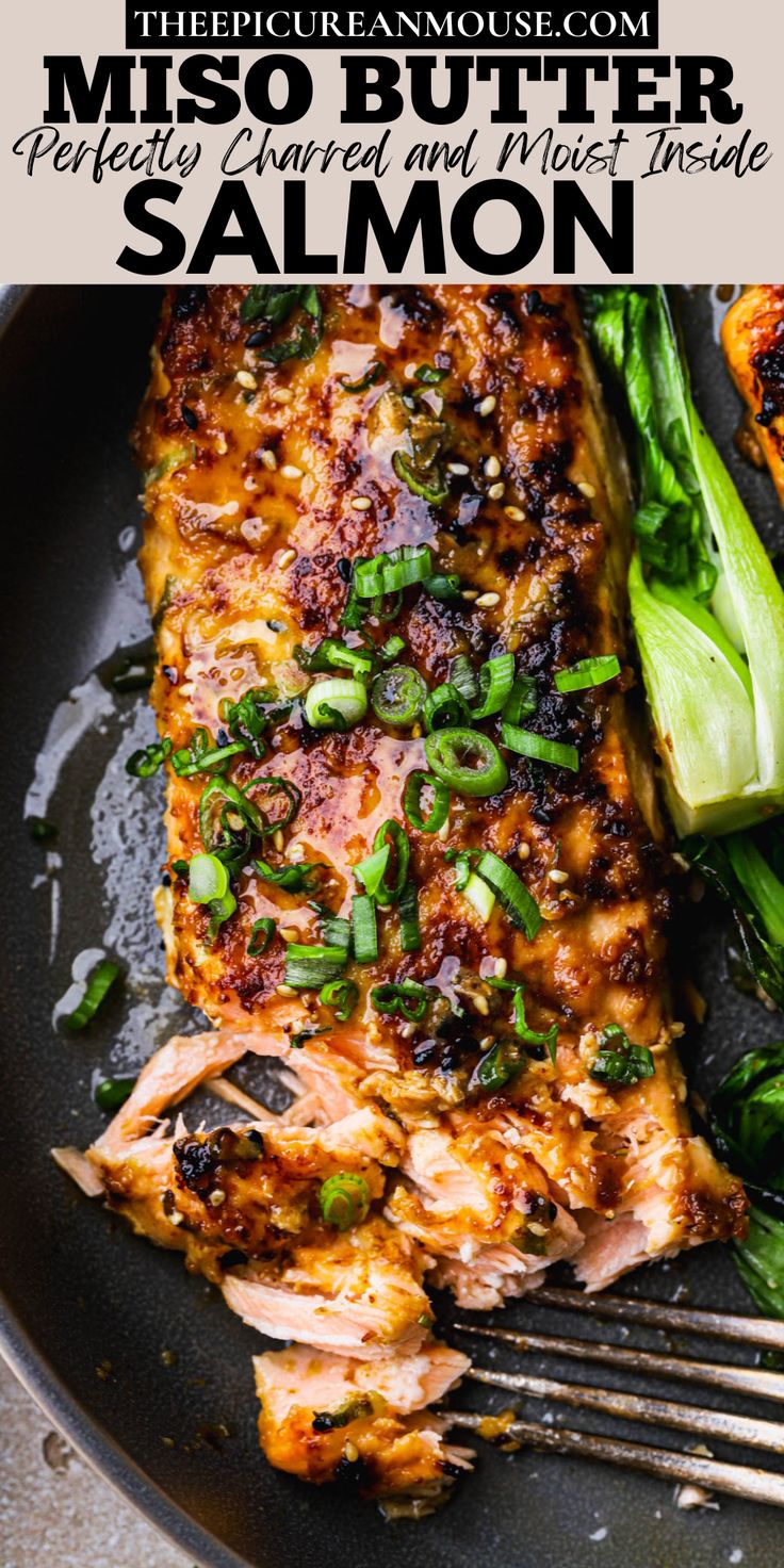 a close up of a plate of food with broccoli and salmon on it