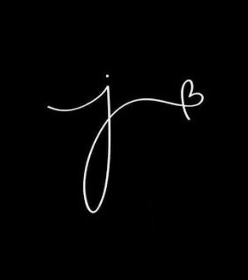 the letter j is written in cursive writing on a black background with white ink