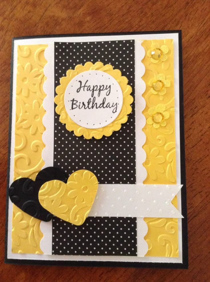 a happy birthday card with a heart on the front and black, yellow and white background