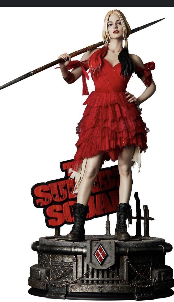 a woman in a red dress holding two swords and posing on top of a sign