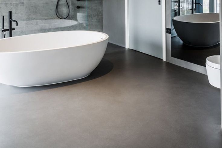 a large white bath tub sitting in a bathroom next to a walk in shower stall