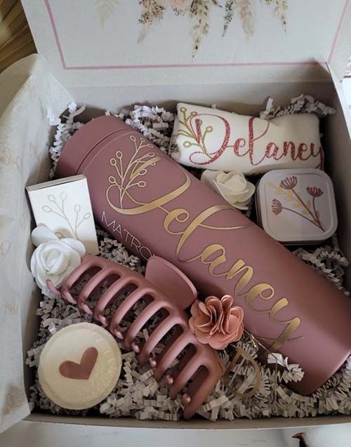 an open gift box filled with decorative items