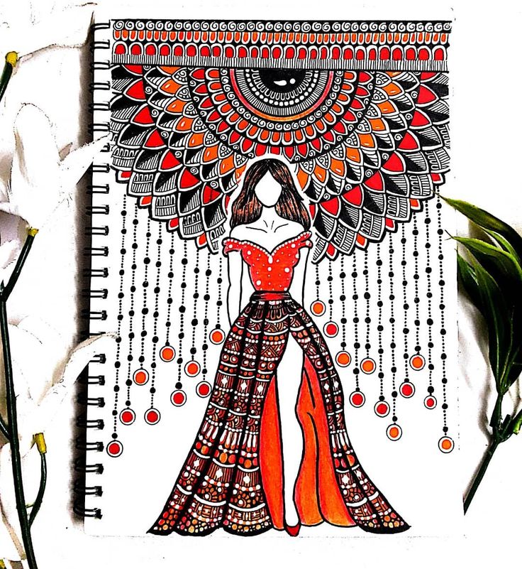 a notebook with an image of a woman in a red dress on it and flowers