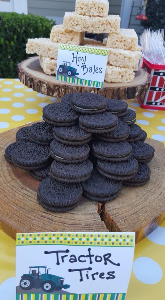 there are many cookies on the table with tags in front of them that say tractor tires