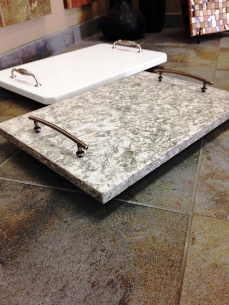 a bath tub sitting on top of a tiled floor