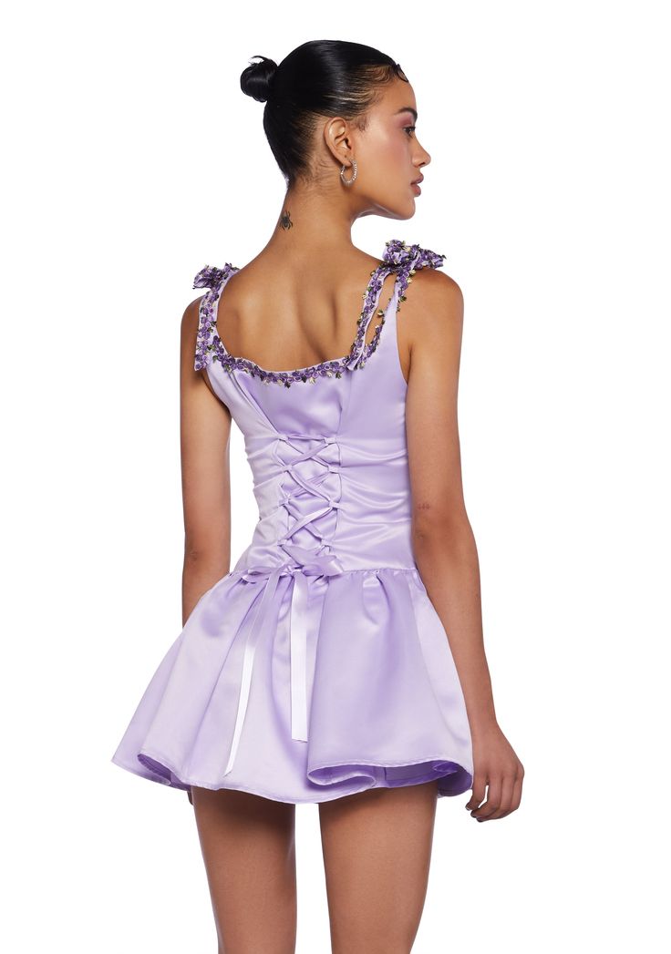 cuz you have the right zip code. This mini dress has a ruched bust, shoulder ties, embroidered floral detailing, a lace up back, and a side zipper closure. Spring Mini Dress With Ruched Bodice For Homecoming, Spring Homecoming Mini Dress With Ruched Bodice, Lavender Dress For Spring Homecoming, Spring Homecoming Corset Dress With Corset Back, Spring Purple Mini Dress With Fitted Bodice, Fitted Corset Dress With Back Zipper For Spring, Purple Mini Dress For Homecoming, Fitted Purple Corset Dress For Spring, Lavender Mini Dress For Prom