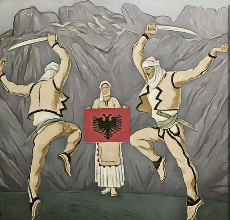 three men are performing an acrobatic dance in front of mountains