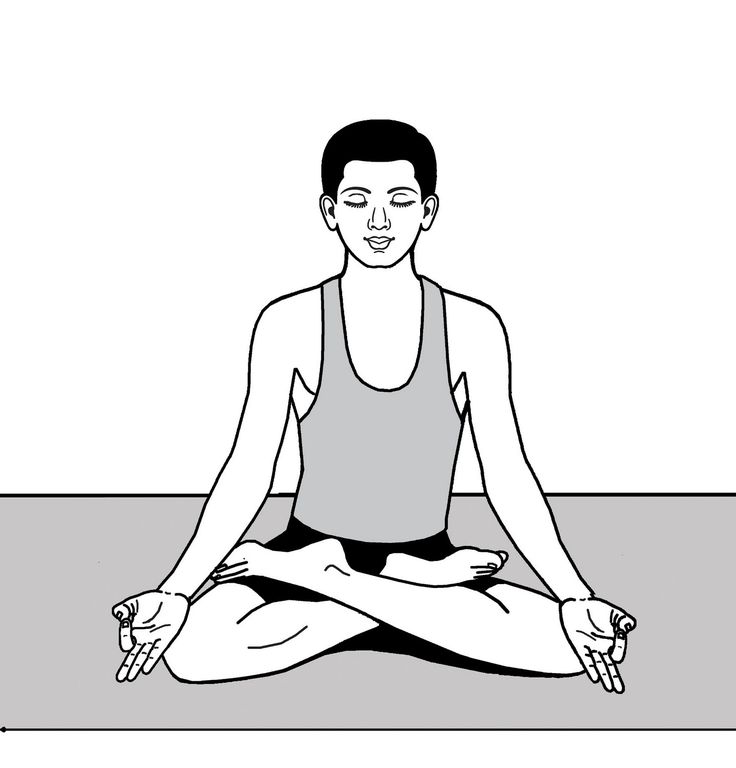 a woman is sitting in the lotus position