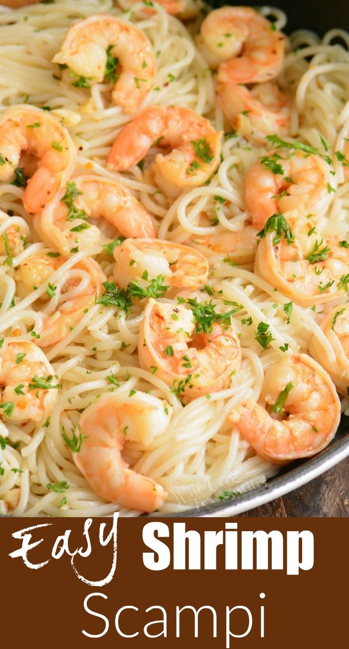 shrimp scampi pasta in a skillet with parsley and parsley on top