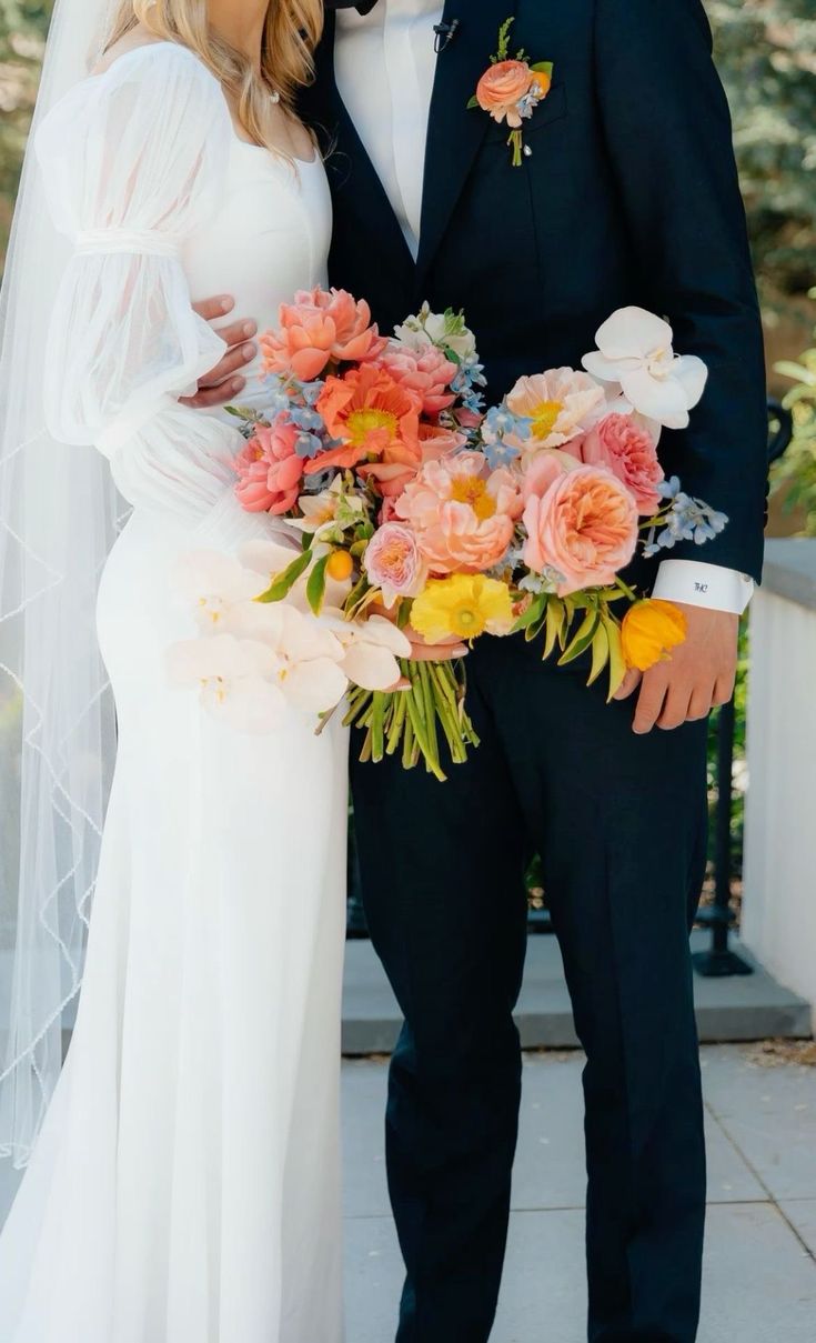 a bride and groom posing for a photo