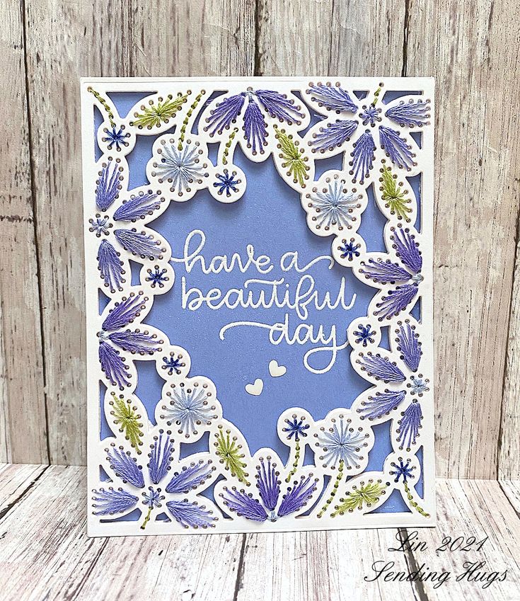 a card with the words have a beautiful day written in blue and green on it