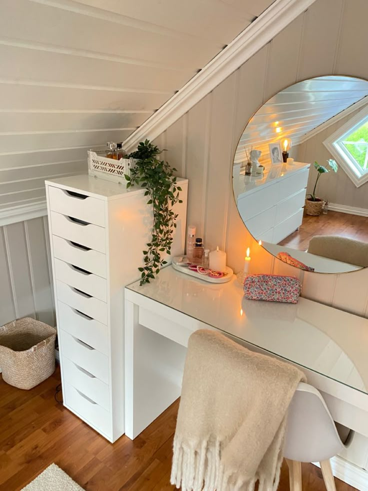 a bedroom with a vanity, mirror and stool in it