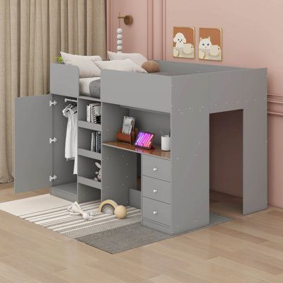 a child's loft bed with desk and drawers in a pink walled nursery room