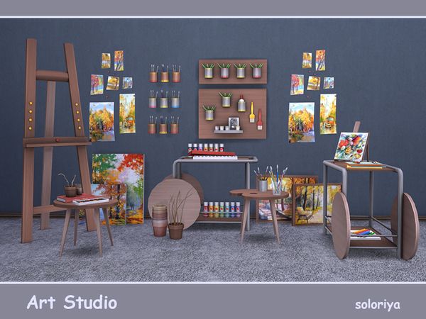 an artist's studio with various paintings and art supplies