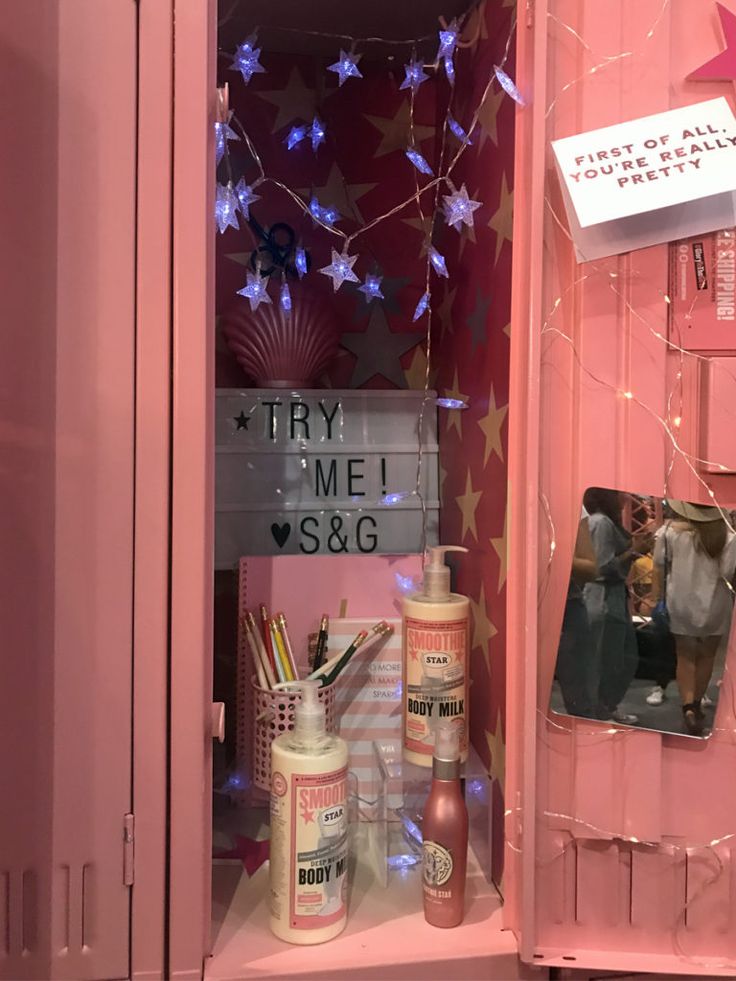 a pink cabinet filled with lots of items