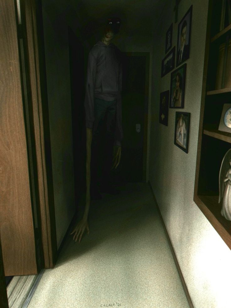 an image of a creepy man walking down the hallway in his house at night time