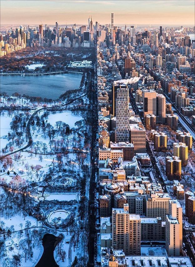 an aerial view of a large city in winter