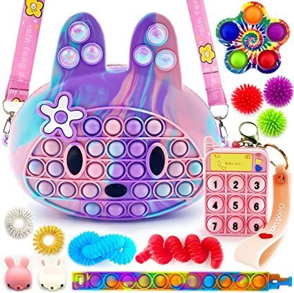 an assortment of toys and accessories including a purse, keychain, bracelets